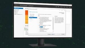 Windows Server Server Manager dashboard showing roles and features on a monitor in front of a data centre server rack